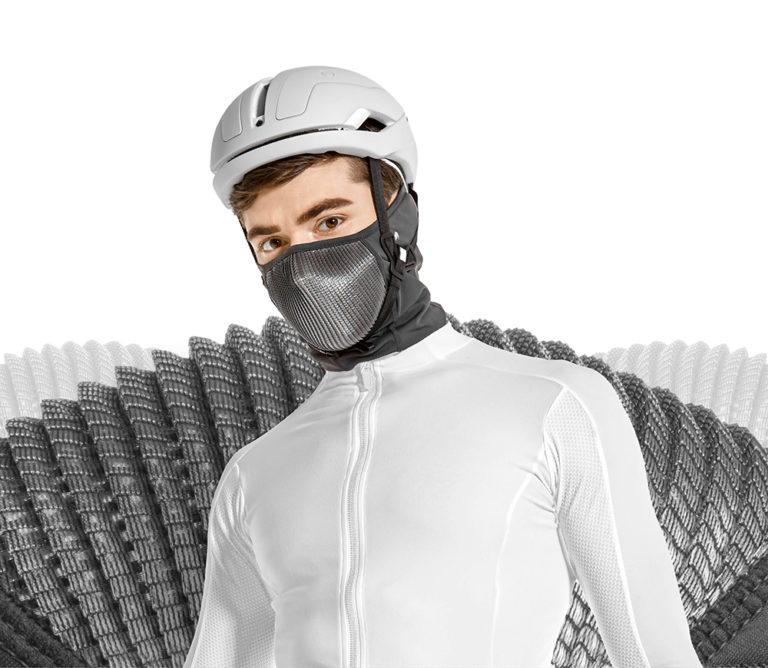 NAROO N0U - gray UV protection sports mask for cycling in the summer and spring on cyclist with EX-SHADER in background v2